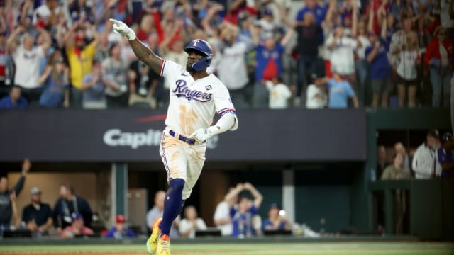Texas Rangers right fielder Adolis Garcia (53) hits a game-winning solo home run during the eleventh inning in game one of the 2023 World Series against the Arizona Diamondbacks at Globe Life Field.